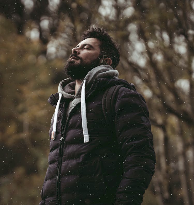 Man In Black Jacket Standing In Rain