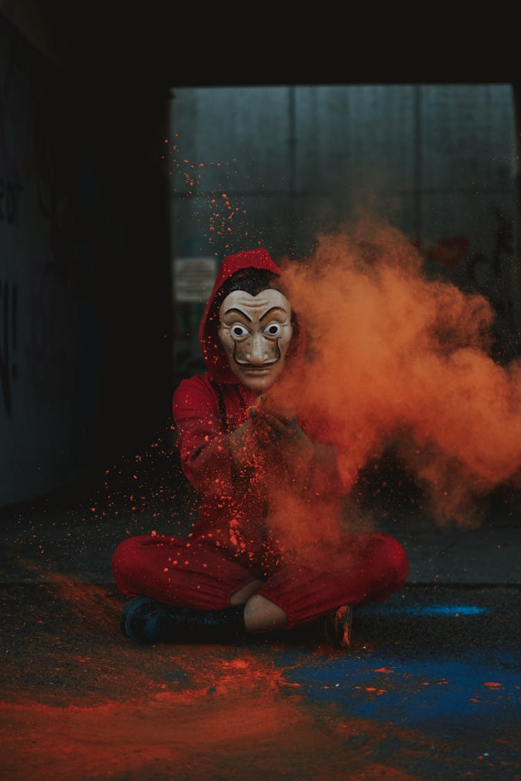 Person In Red Costume For Frightening