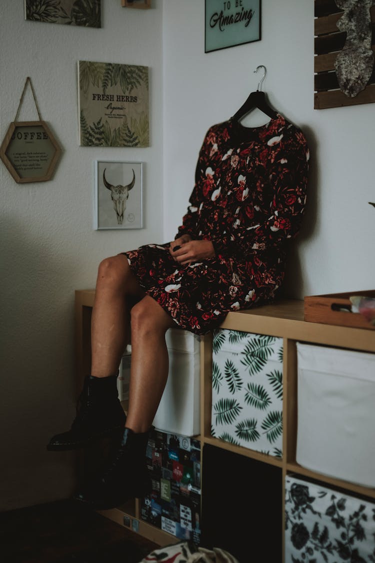 Woman In Dress With Hanger Instead Head