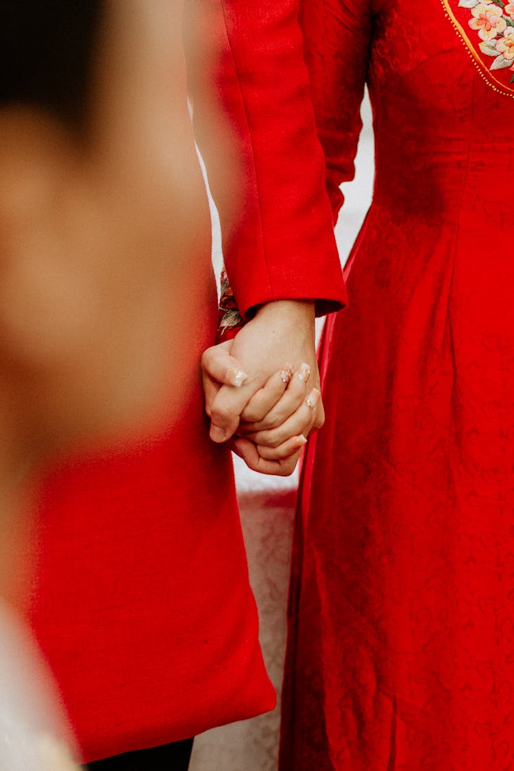 Crop Couple In Traditional Red Apparels On Wedding Day