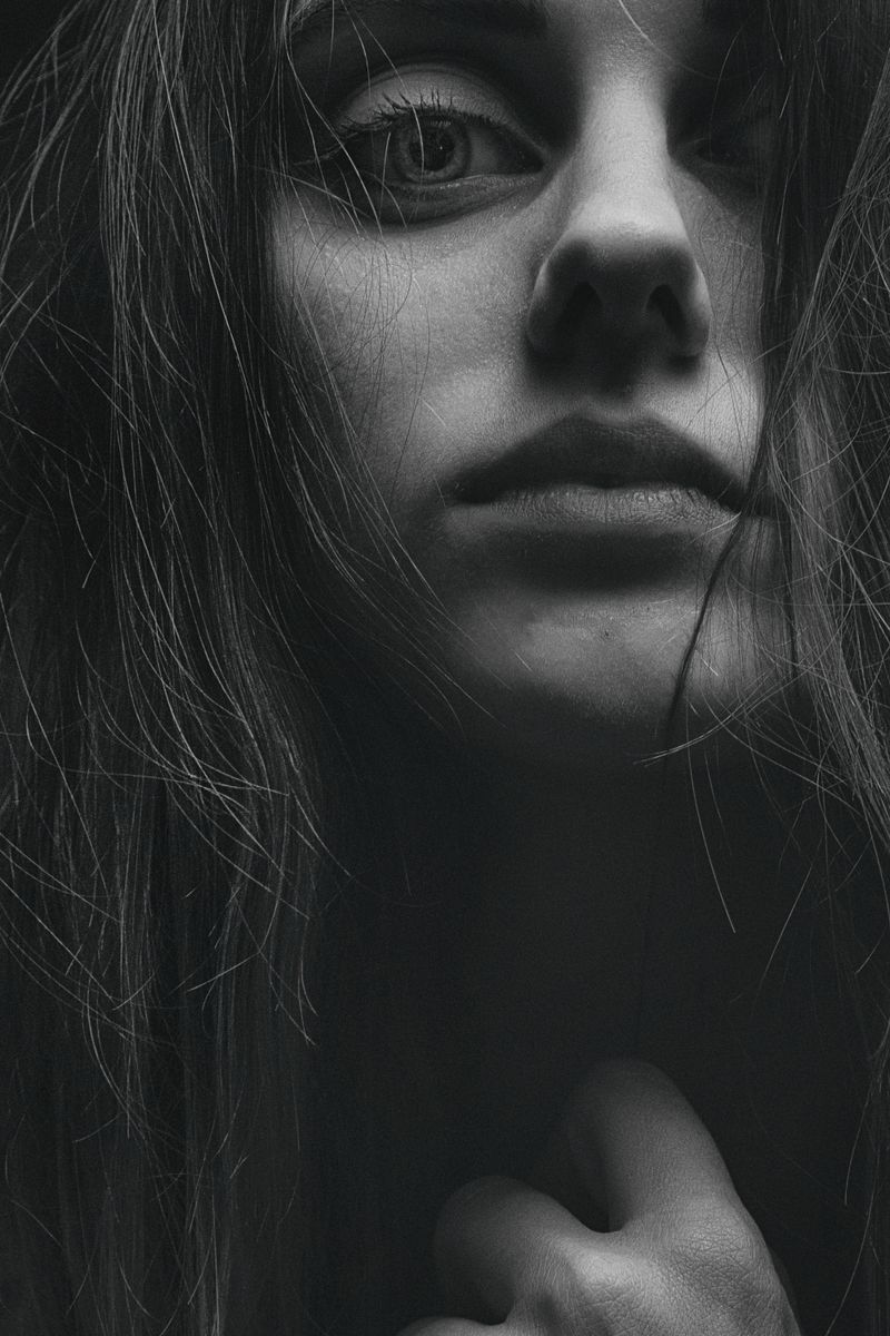 Monochrome close-up portrait of a woman — photo by Alexander Krivitskiy on Pexels