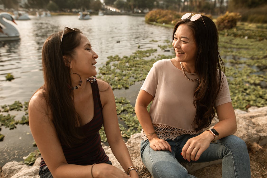 Free Two Women Talking and Smiling Stock Photo
