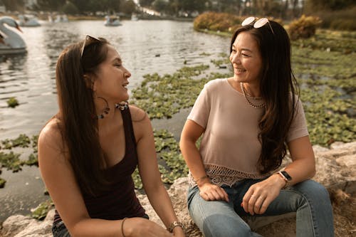 Two Women Talking and Smiling