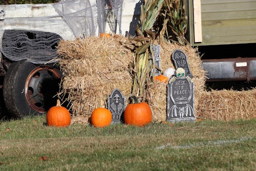 Halloween Composition with Hay and Tombstones