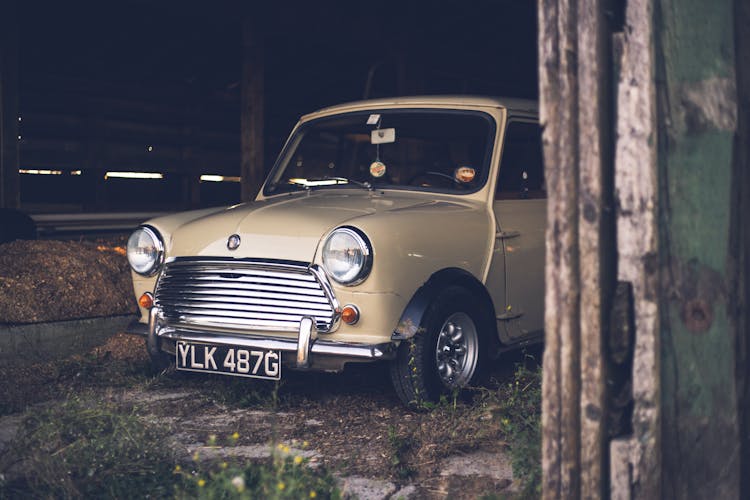 Old Fashioned Car Parked In Barn