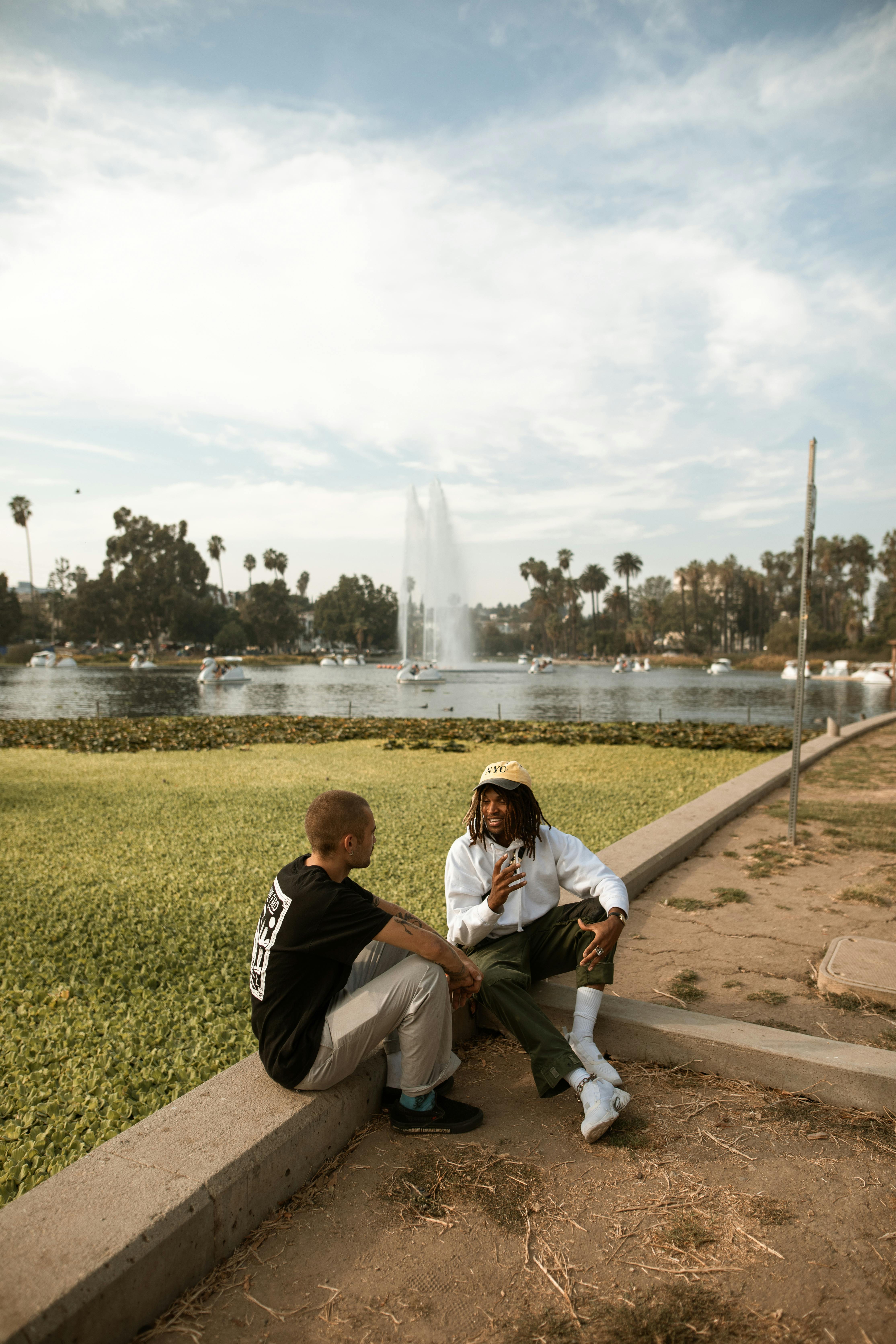 men talking at a park