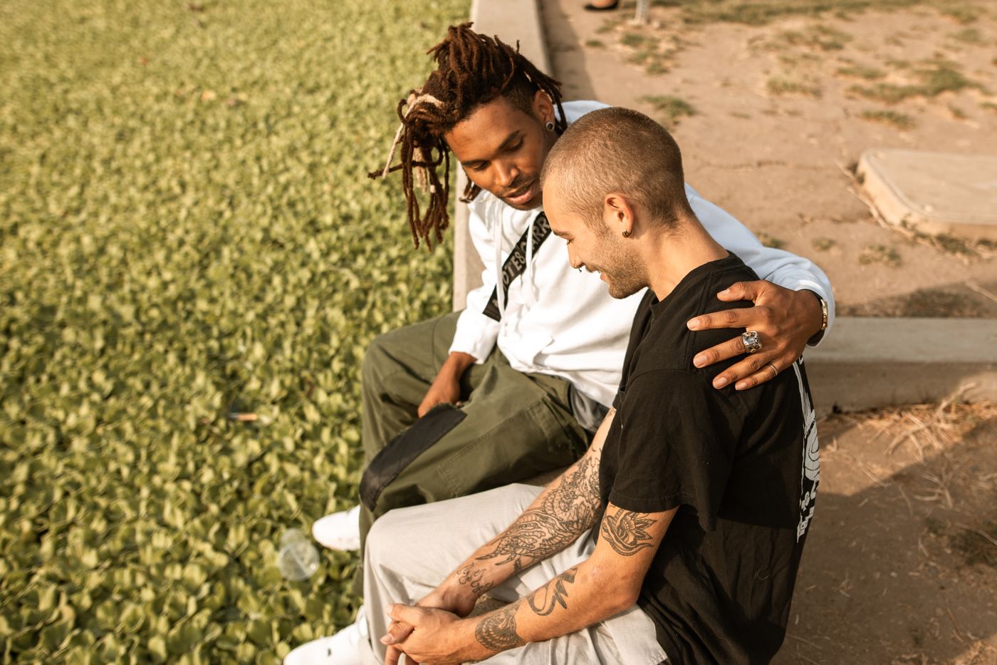 Two friends sharing a supportive conversation outdoors, representing healthy social connection while coping with depression