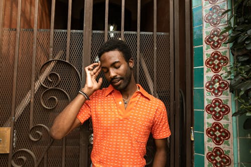 A Man in Orange Polo Shirt