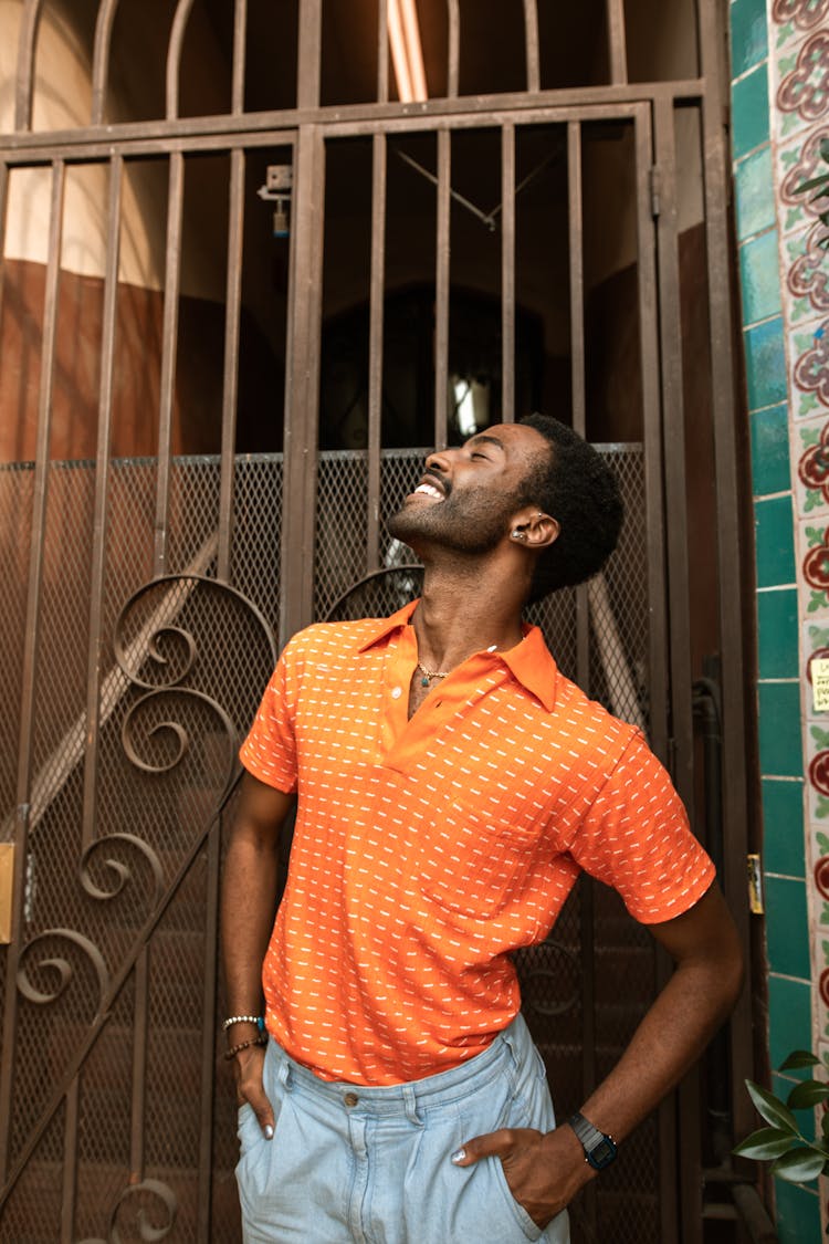 Happy Man Wearing An Orange Shirt