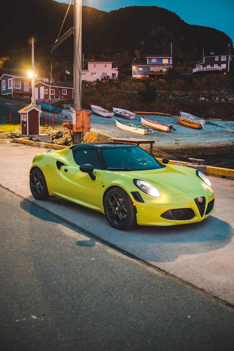 Luxury Yellow Car Parked On Asphalt Near Beach