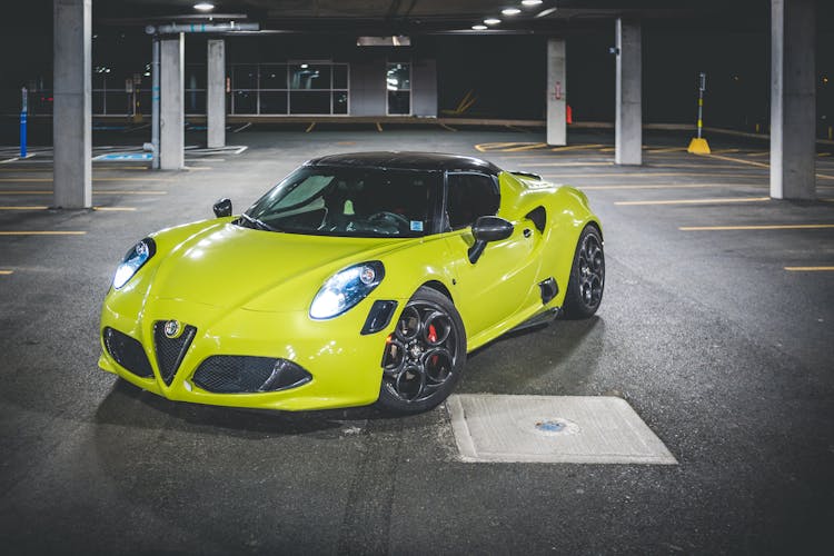 Luxury Racing Car On Asphalt Urban Parking At Night