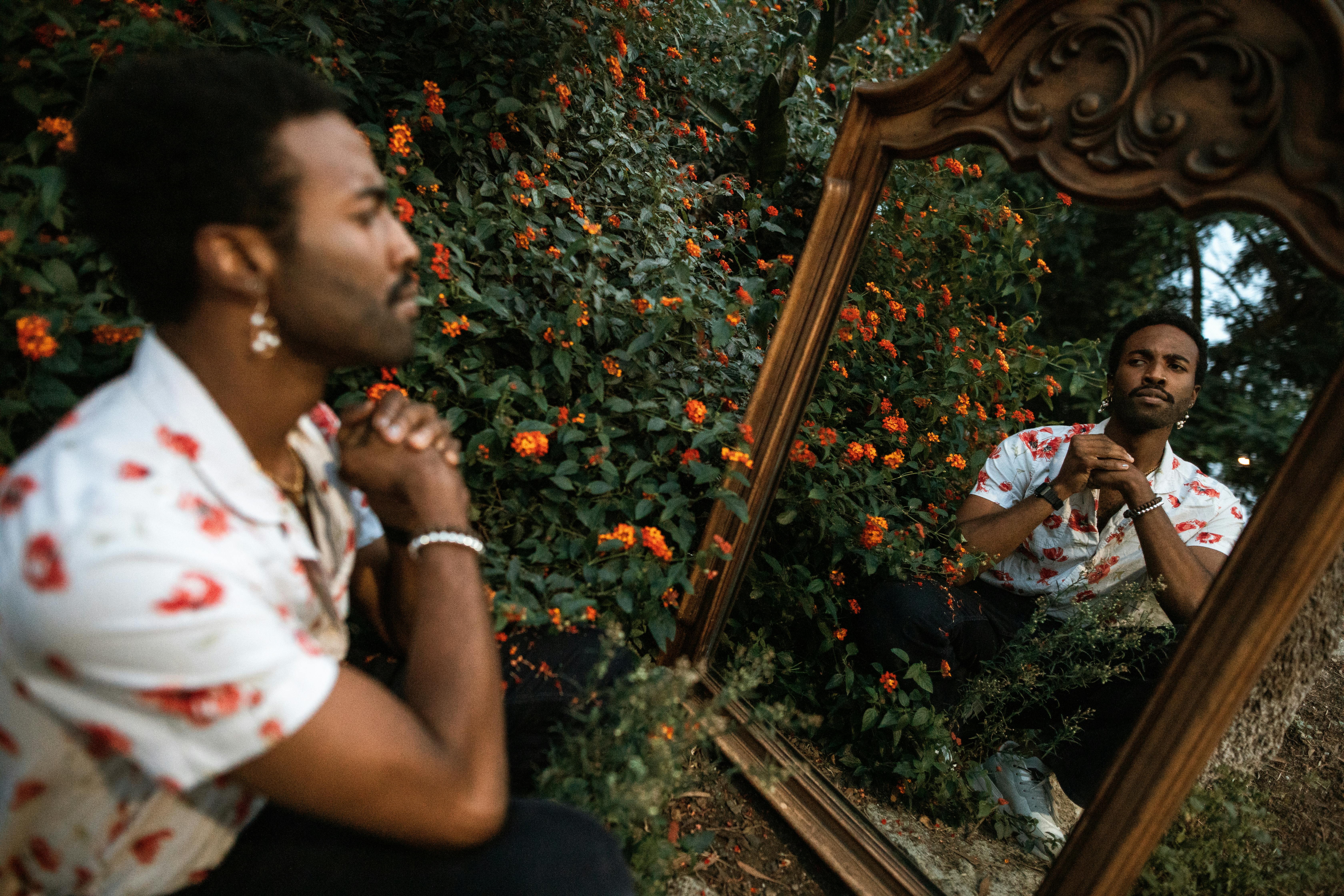 a man looking at a mirror