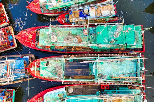 Red and Green Boats on Water