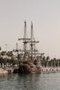 Brown and Black Galleon Ship on Body of Water