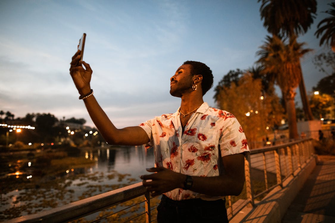 Free Man Taking a Selfie at a Park Stock Photo