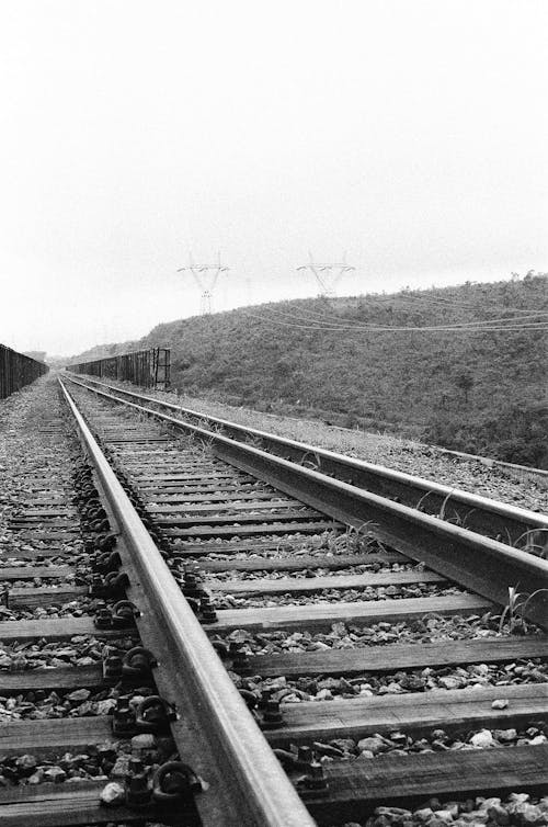 Grayscale Photo of Train Railway