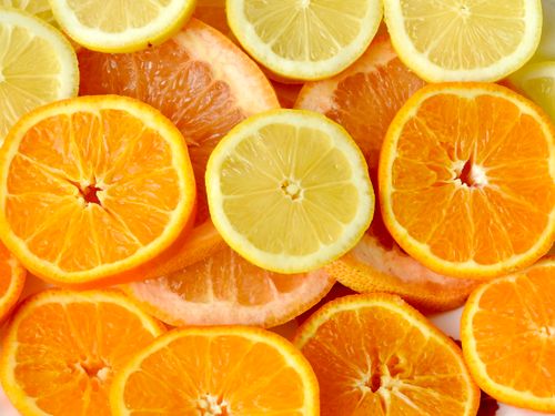 Free A colorful array of sliced citrus fruits showcasing their freshness and variety from a top view. Stock Photo
