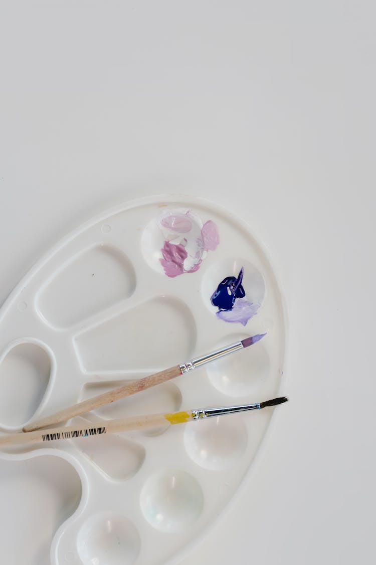 Overhead Shot Of A Palette Tray With Paint And Paintbrushes