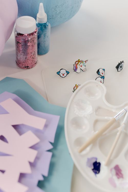Free A creative arrangement of colorful art materials on a white background. Stock Photo