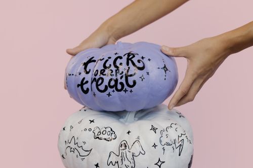 Free Purple and white painted pumpkins for Halloween. Trick or Treat theme. Stock Photo