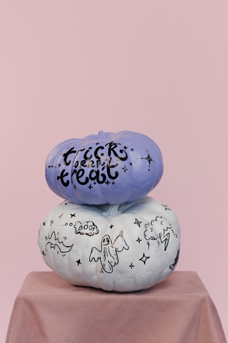 White And Purple Pumpkins With Scary Drawings