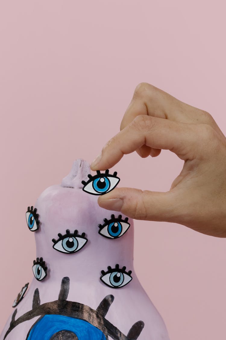 Close-Up Shot Of A Person Holding An Eye Drawing Cutout