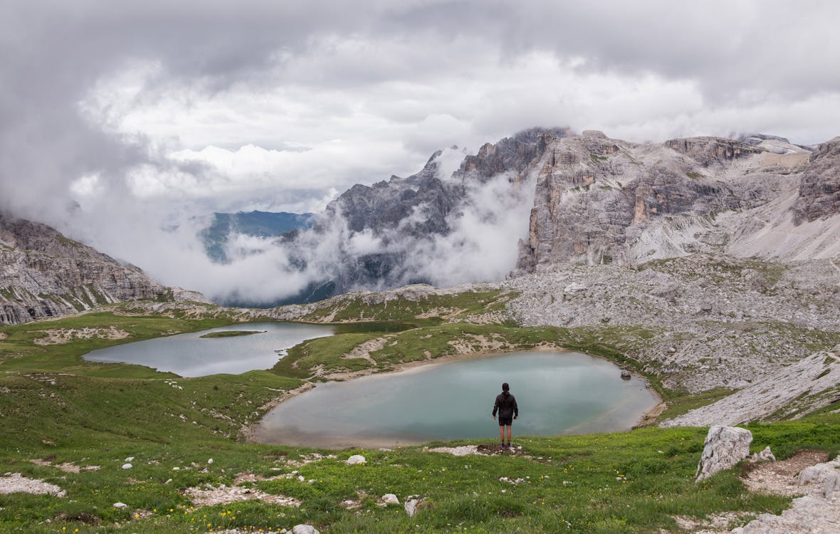 Person Standing Near Body of Water