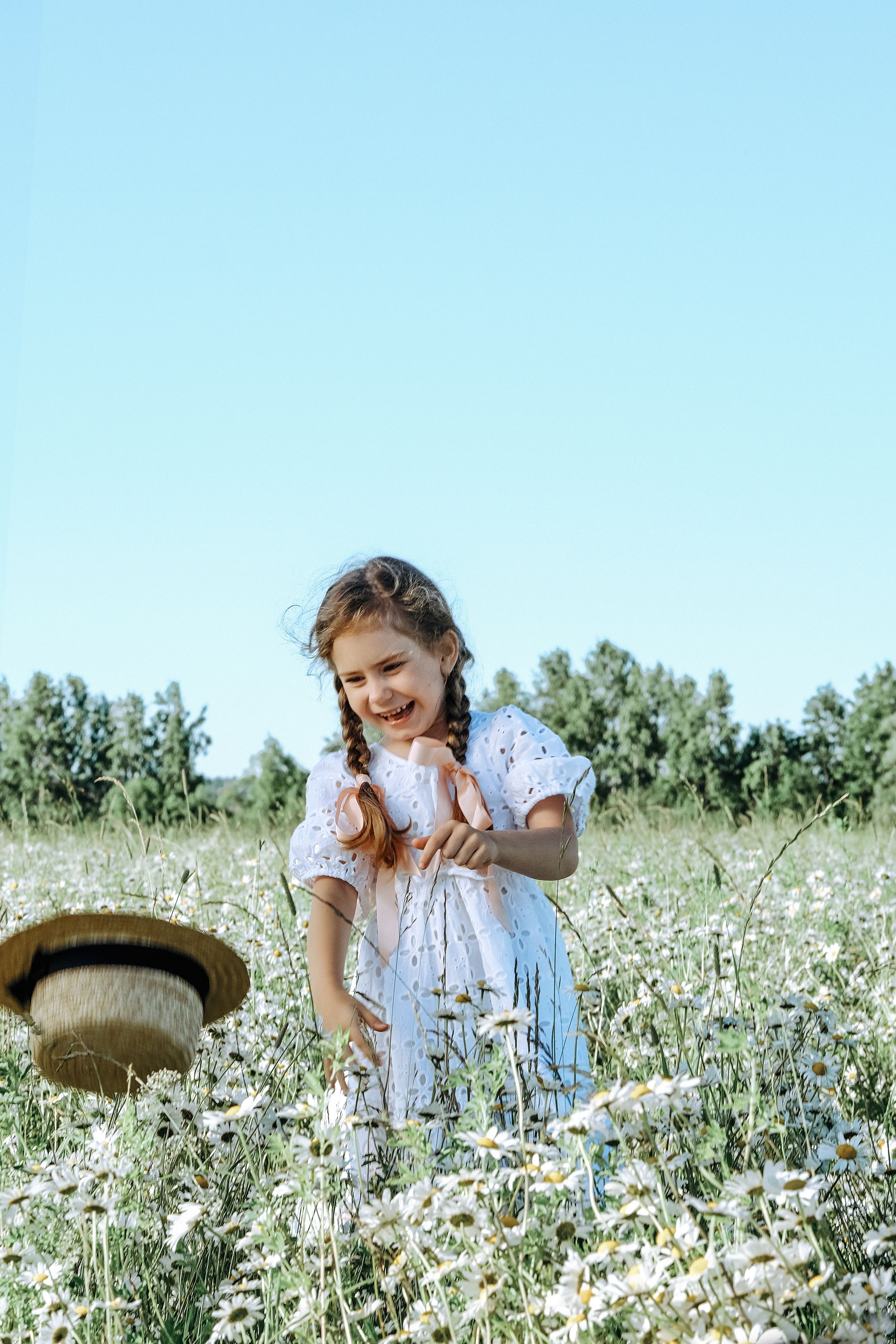 Girl in Blue Dress in Field of Flowers · Free Stock Photo