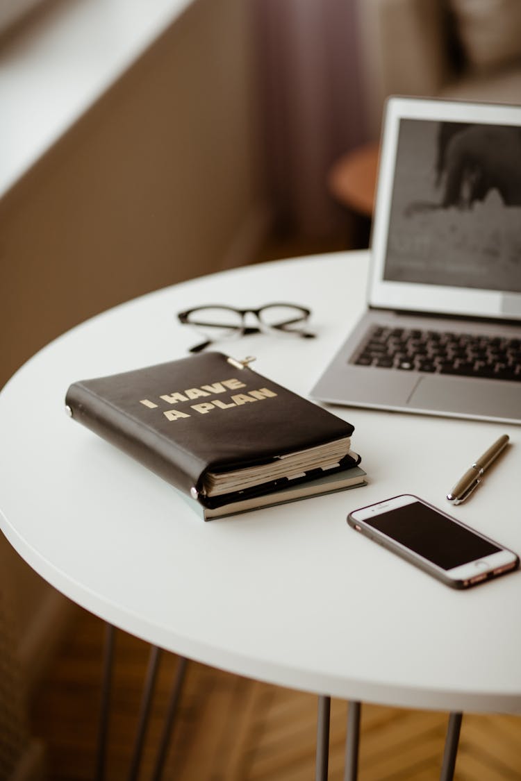 Notebooks And Laptop On A Table 