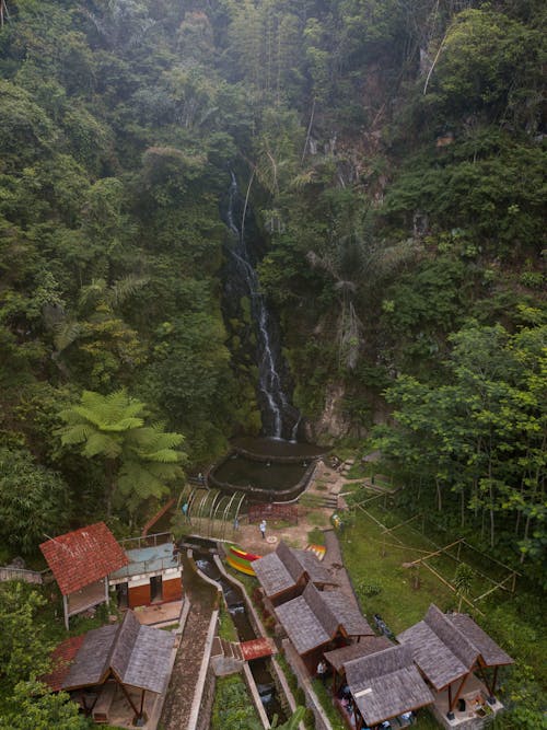 House Buildings by the Waterfall 
