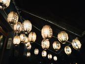 White Paper Lanterns on Black Metal Frame