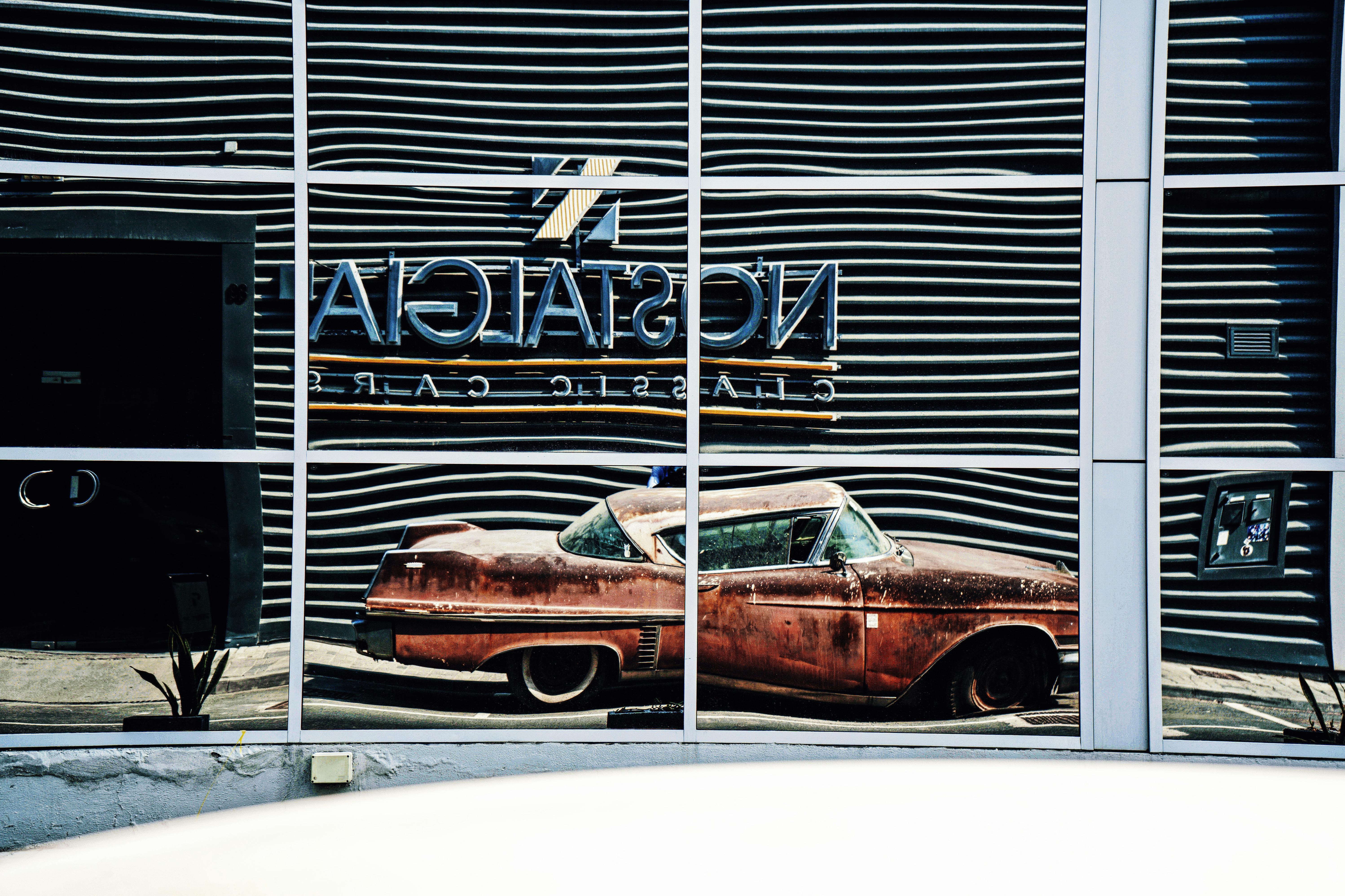 Reflection of an Old Car in Window · Free Stock Photo