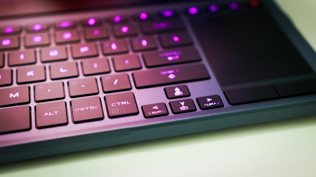 Detailed view of a stylish laptop keyboard featuring customizable RGB backlighting and modern design.