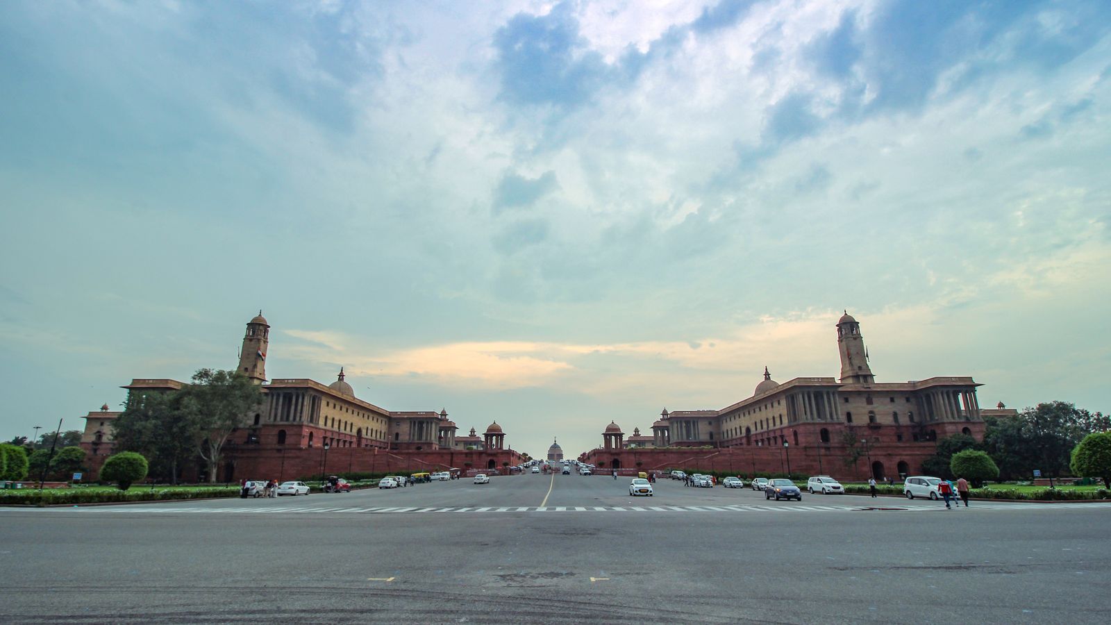 A panoramic view of the Secretariat Buildings in New Delhi, India, under a clear sky.