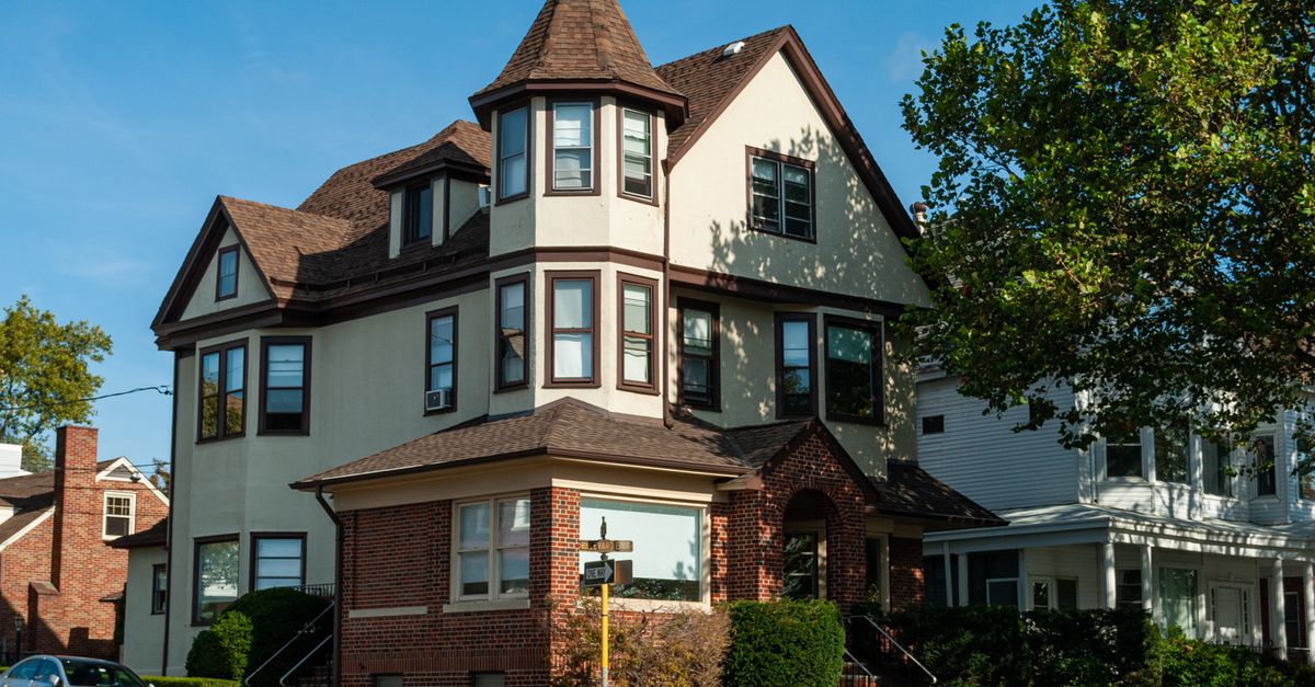 Elegant suburban mansion in New Jersey showcasing classic architecture and lush surroundings.