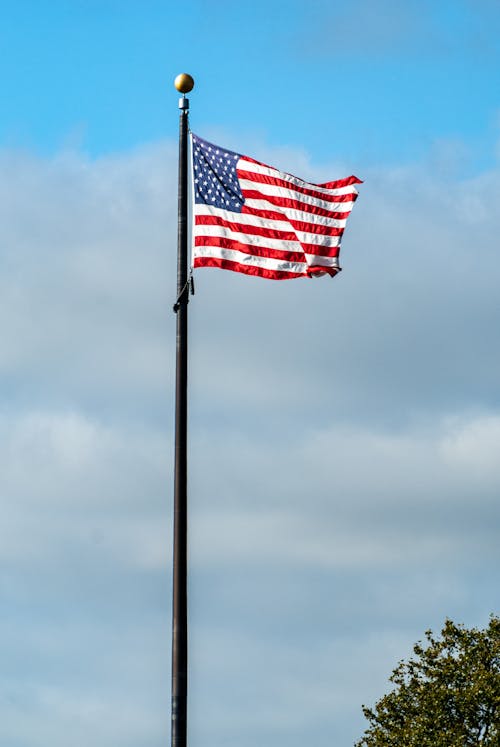 US Flag on Pole Under Blue Sky