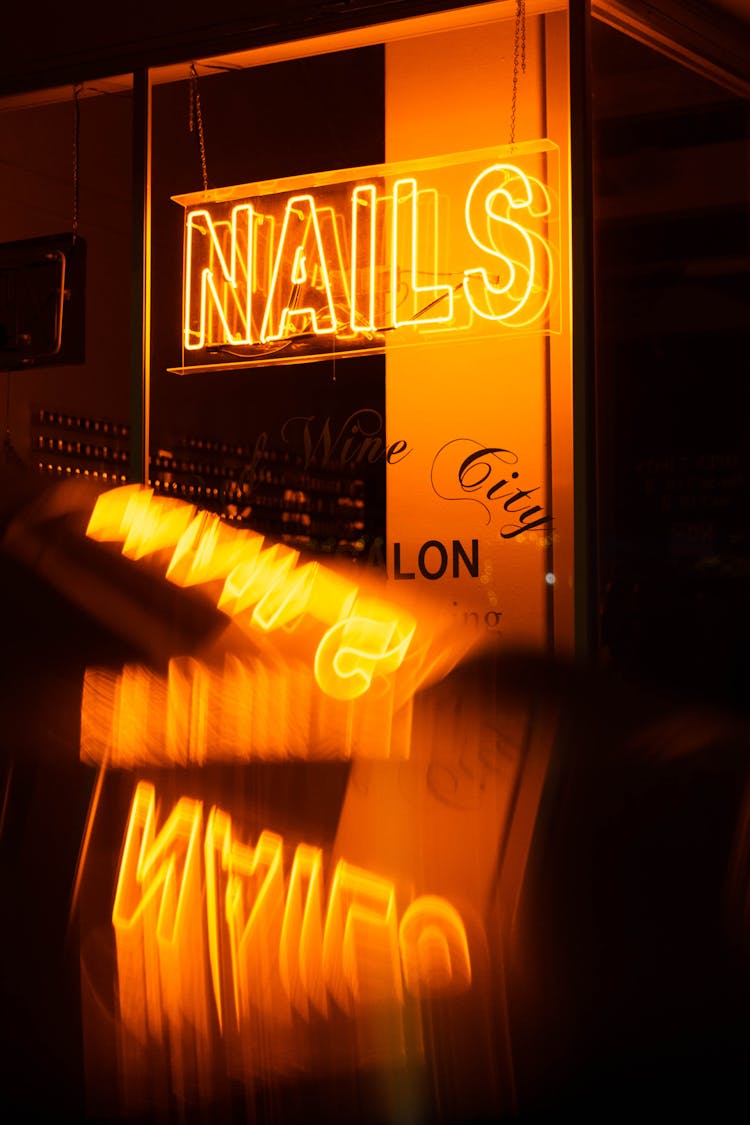 Close-up Of Orange Neon Sign