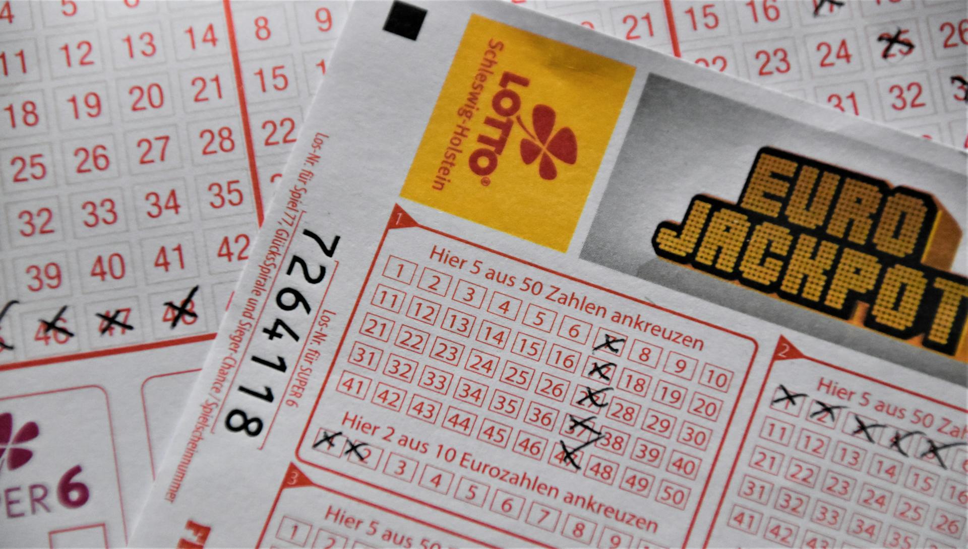 Detailed close-up of a EuroJackpot lottery ticket with selected numbers in focus.