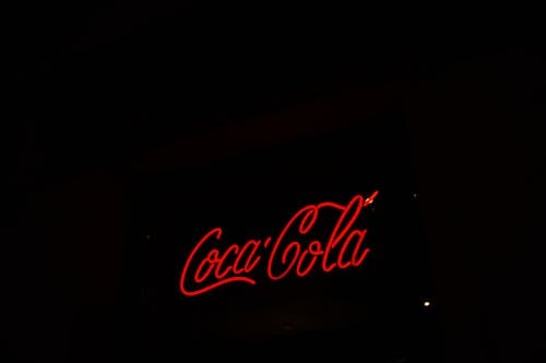 A Red Text Neon Sign