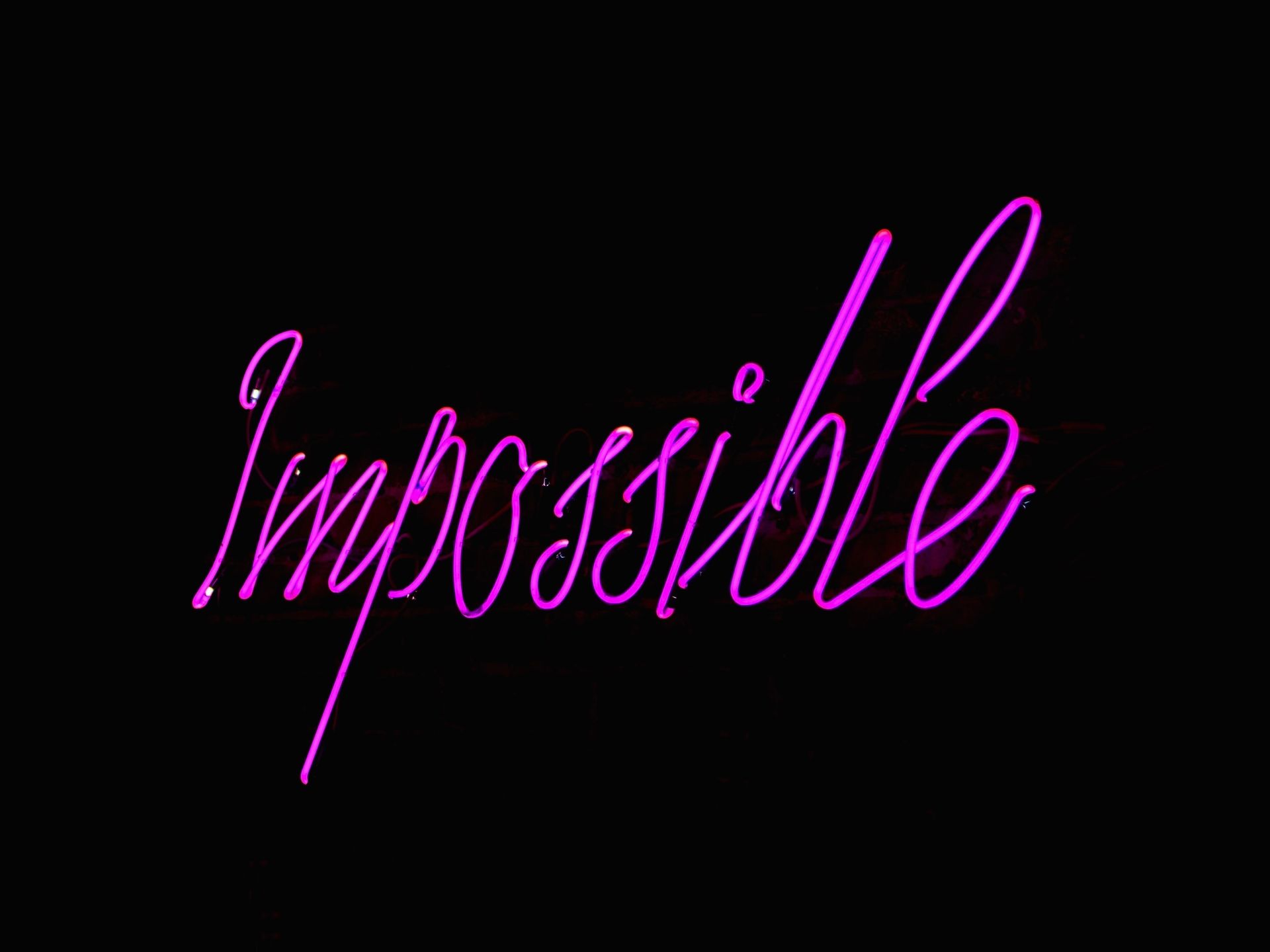 A Purple Text Neon Sign
