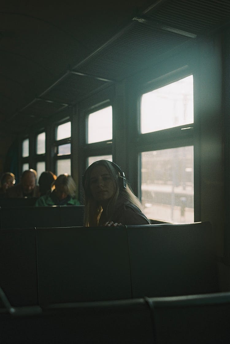 Woman Sitting In Train Car