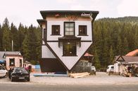 White and Brown Wooden House Near Green Trees