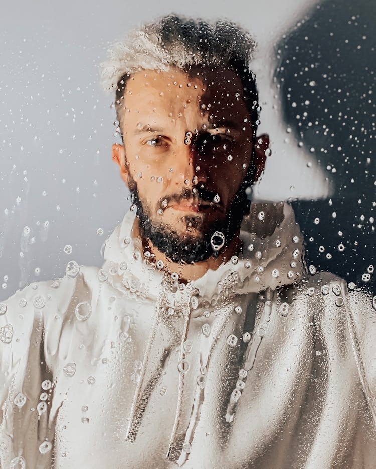 Portrait Of Man Behind Glass