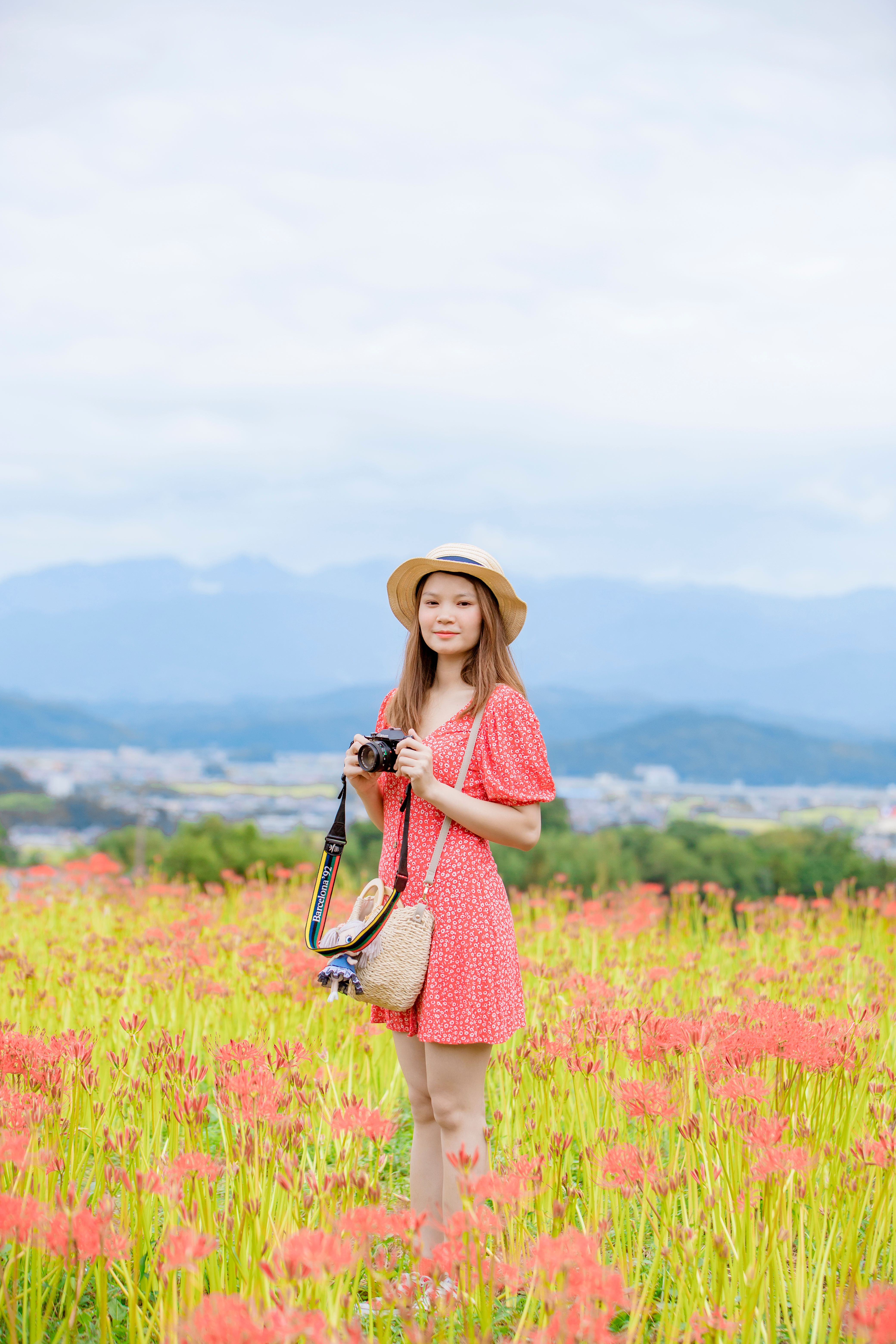 Woman in Pink Dress Standing on Grass Field · Free Stock Photo