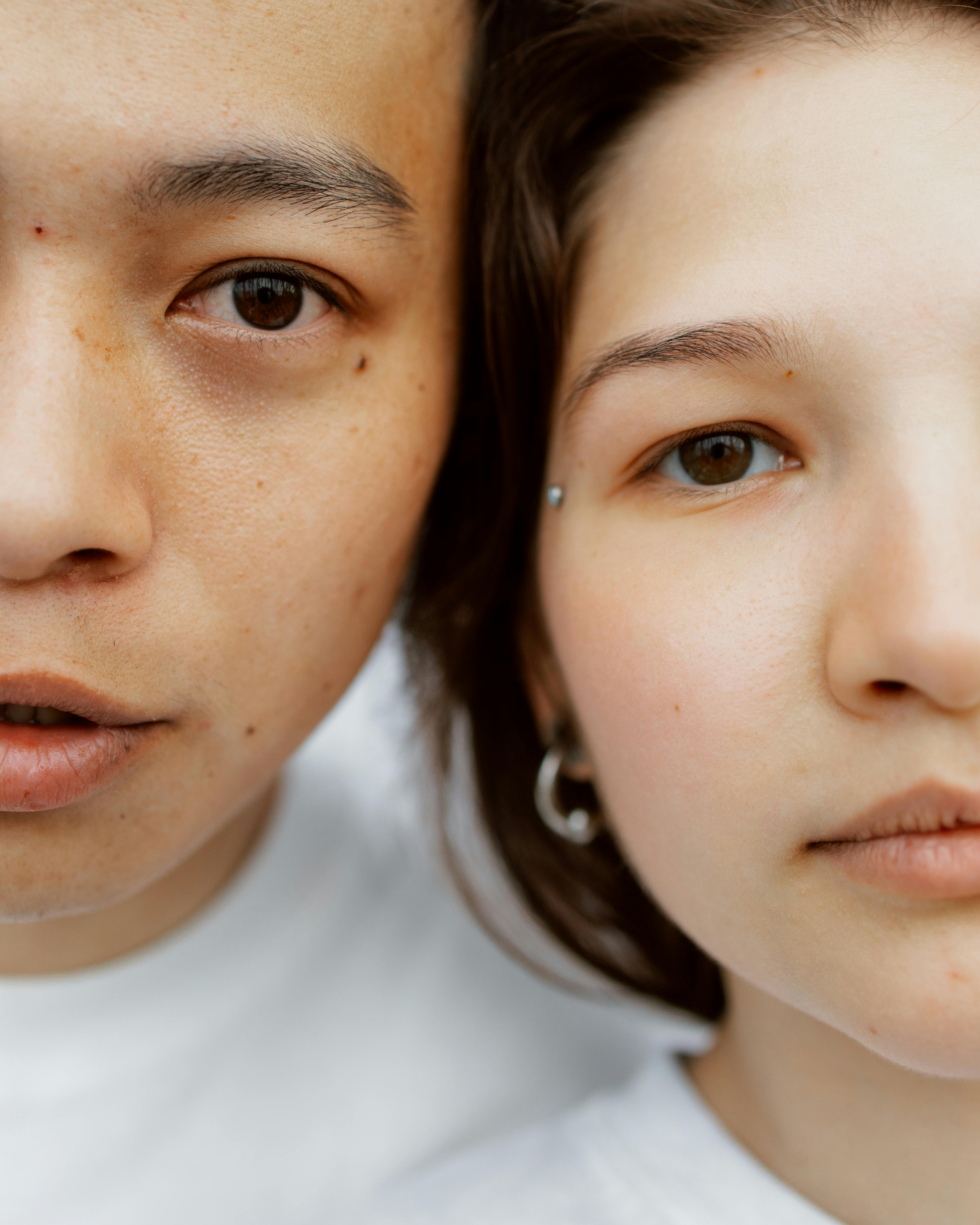 Intimate close-up portrait of a diverse couple showing connection.