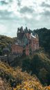 Brown and Gray Concrete Castle on Top of Mountain