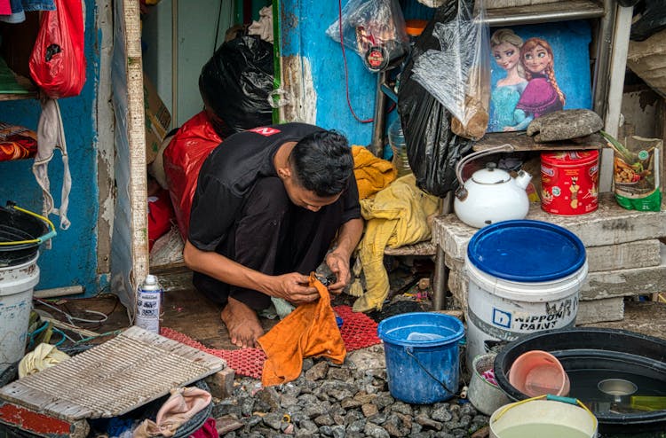 Man Cleaning Rocks