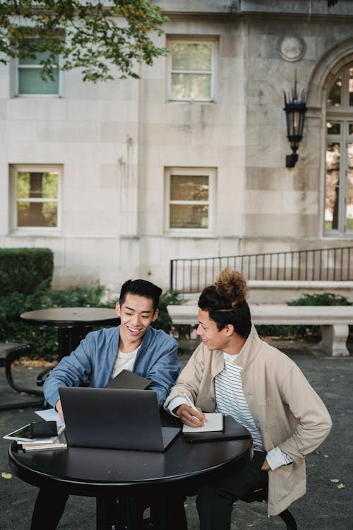 Men Looking At A Laptop