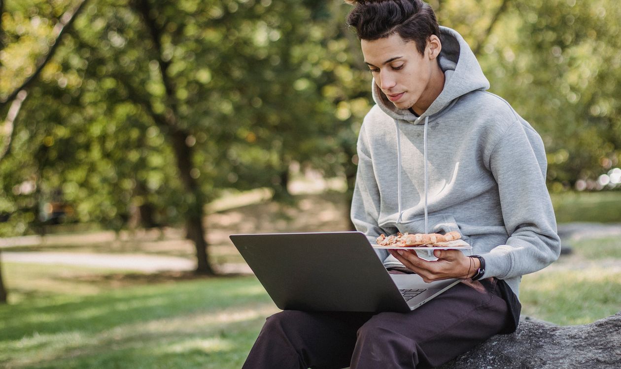 Student studying for the Duolingo English Test on a laptop