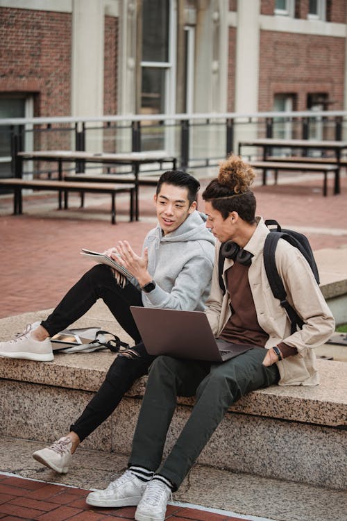 Diverse students with laptop on border